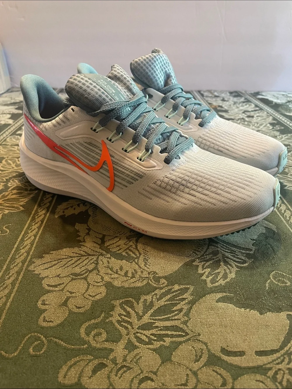 Nike Air Zoom Women’s Light Gray and Teal Running Sneakers with Orange Swoosh